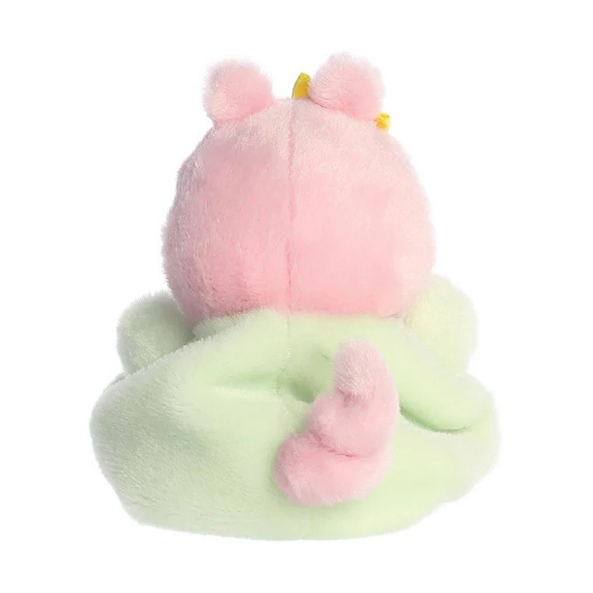 Back view of the Aurora Peppa Pig plush showcasing her pastel green outfit and signature curly pink pig tail.