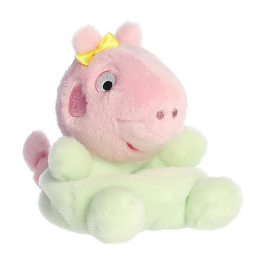 Front angled view of the 5-inch Aurora Palm Pals Peppa Pig Baby Evie plush toy wearing a pastel green outfit and a yellow bow.