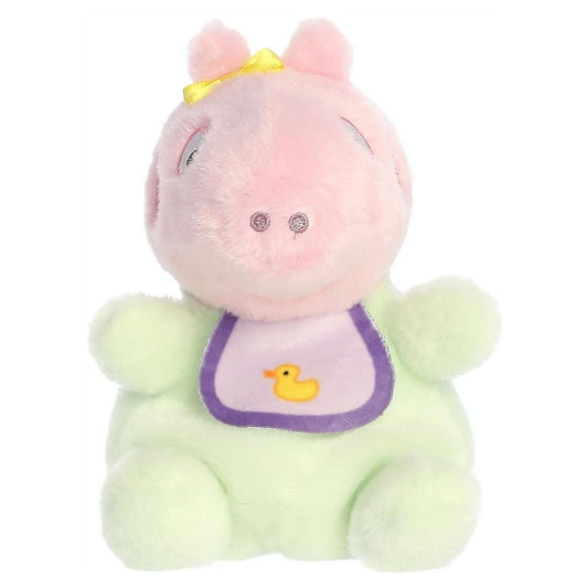 Straight-on front view of the soft Palm Pals plush Baby Evie featuring a yellow bow and a purple bib with a yellow duck.