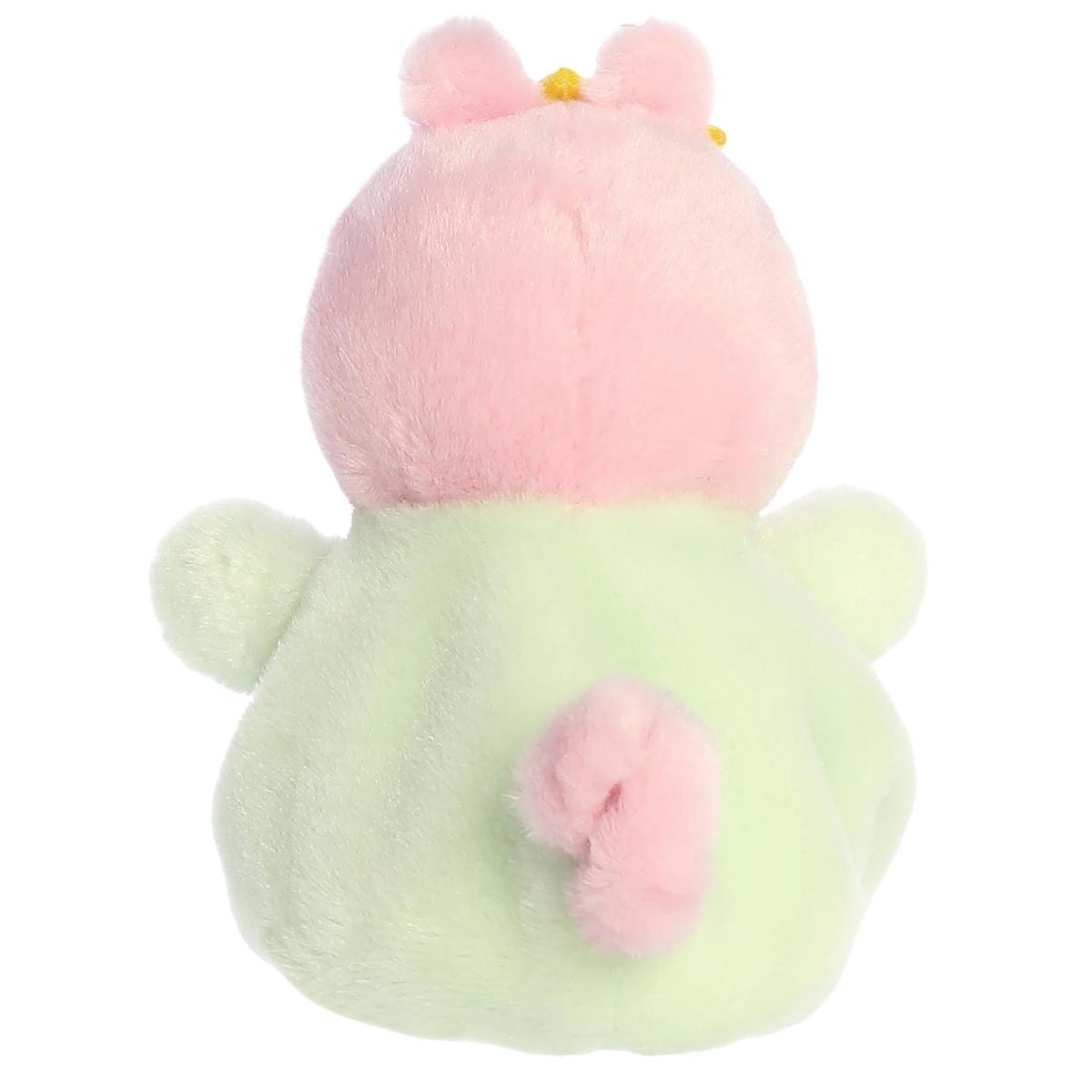 Direct back view of the cuddly Baby Evie stuffed animal showing its little green outfit and curly pink tail.