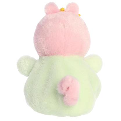 Direct back view of the cuddly Baby Evie stuffed animal showing its little green outfit and curly pink tail.