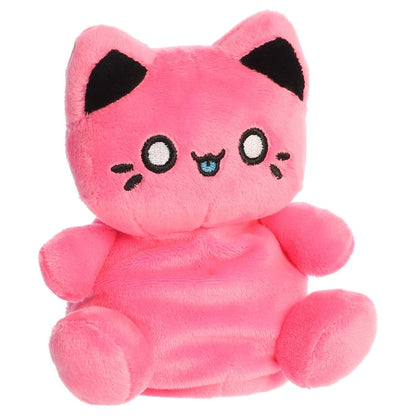 Front angled view of the 5-inch Aurora Palm Pals Tasty Peach Vivid Pink Meowchi plush toy featuring a bright pink body and kawaii embroidered face with a blue tongue.