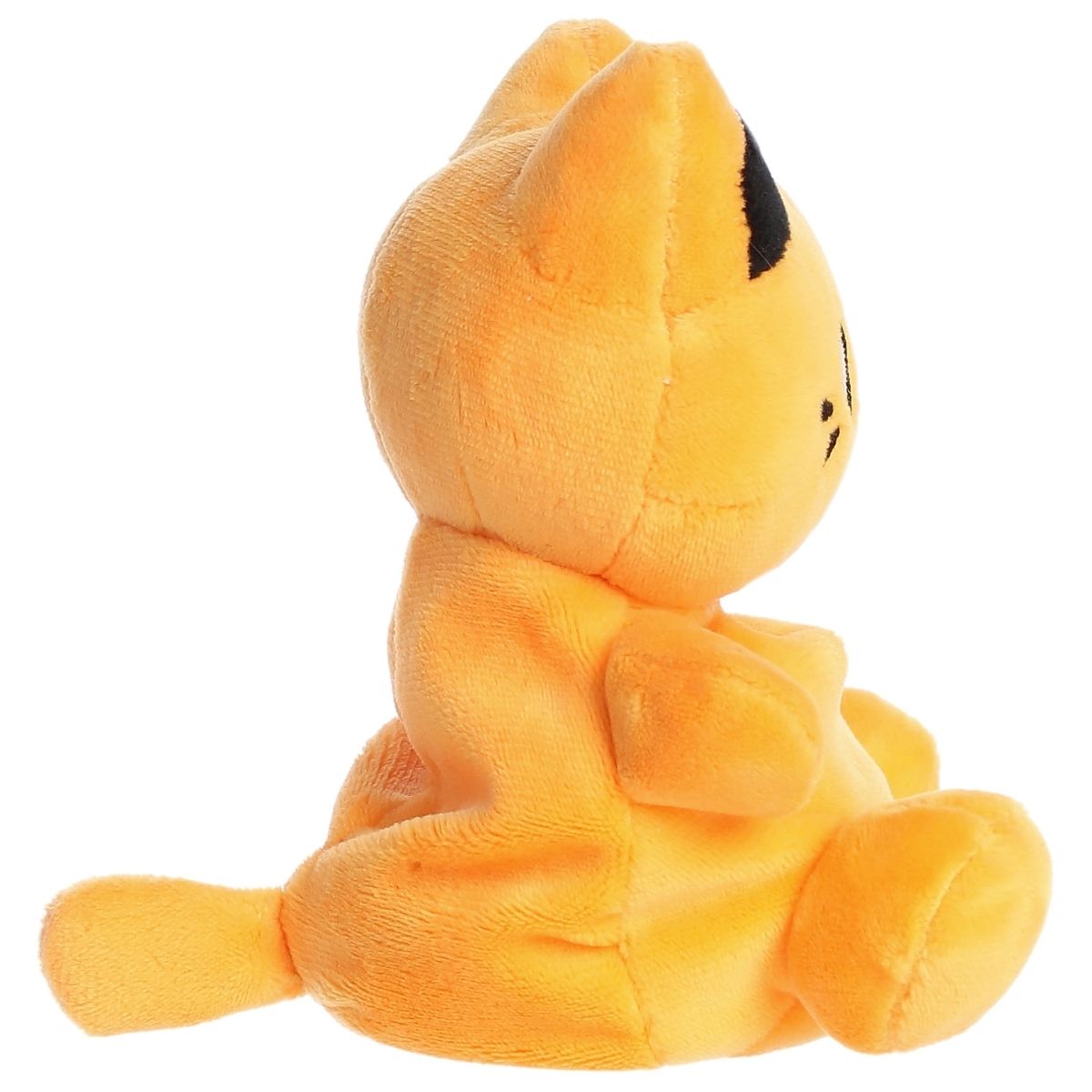 Side profile view of the Palm Pals Kinetic Orange Meowchi highlighting its plump, rounded shape and little plush tail.