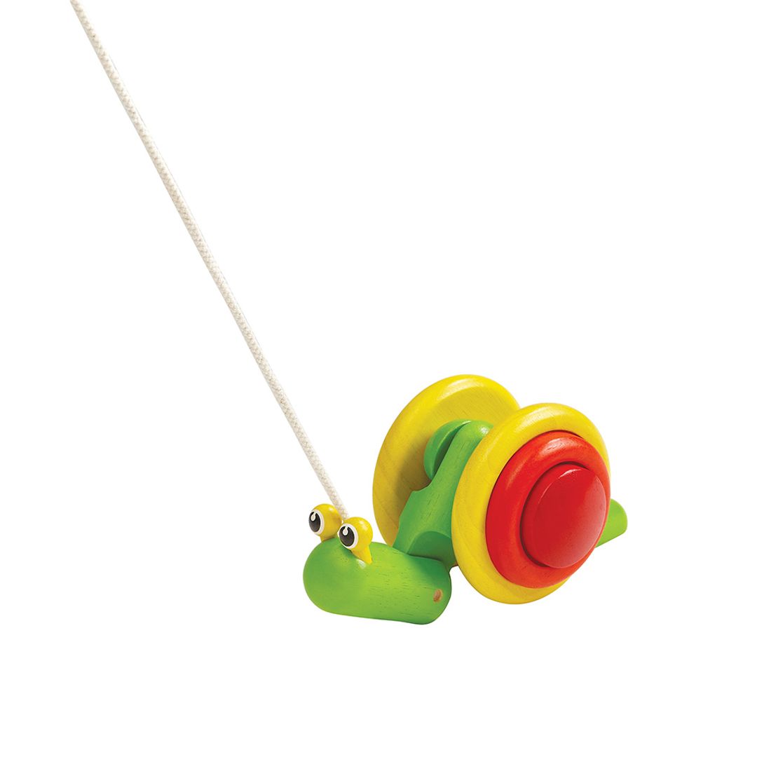Pull along PlanToys wooden pull-along snail toy featuring a bright green and yellow shell.
