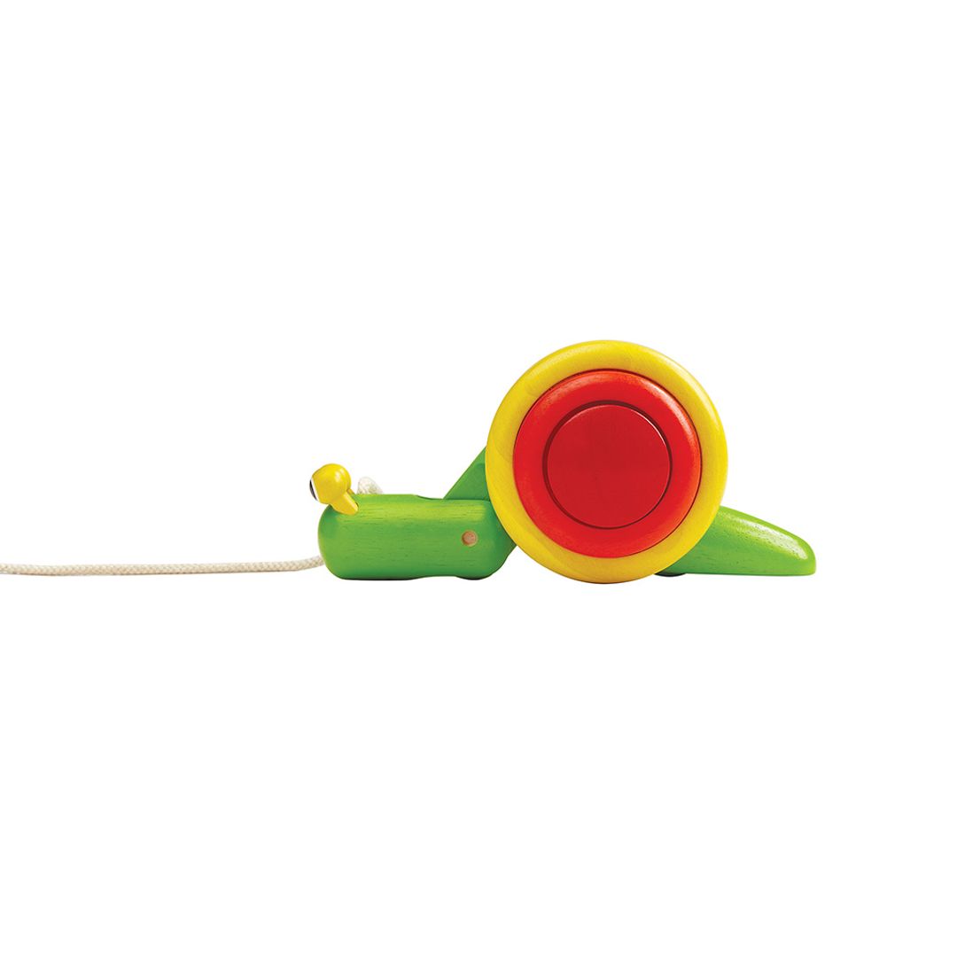 Side angle of the PlanToys pull-along snail showing its sturdy pull string and unique and colorful crawling wheel design. 