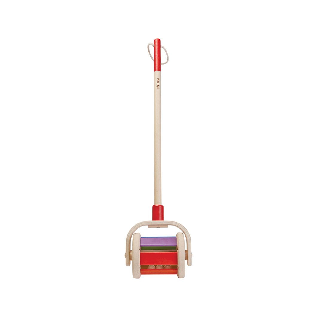 Front profile of the durable PlanToys wooden push toy showcasing its smooth wheels and red handle grip.
