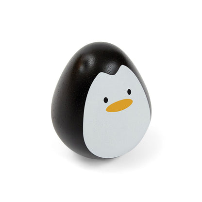 Angled view of the non-toxic PlanToys penguin wobbler baby toy showcasing its weighted, egg-shaped design.