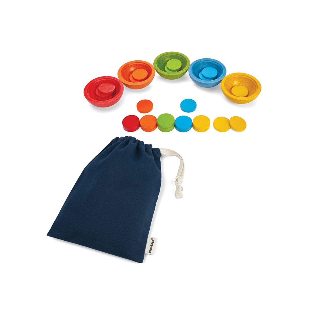 The complete PlanToys sort and count educational toy set laid out next to its handy blue storage pouch.