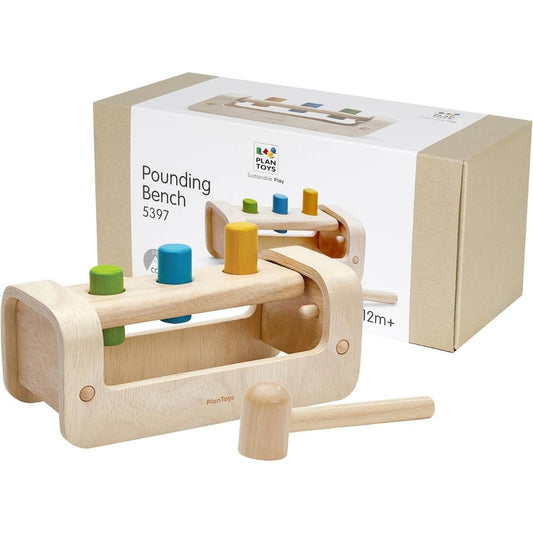 he eco-friendly PlanToys wooden pounding bench with hammer displayed next to its sustainable packaging.