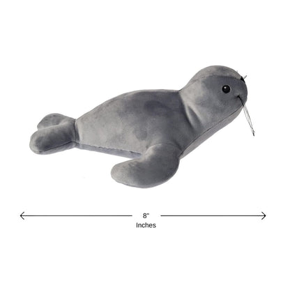Close up of the friendly sculpted face, whiskers, and embroidered eyes of the gray seal plush.