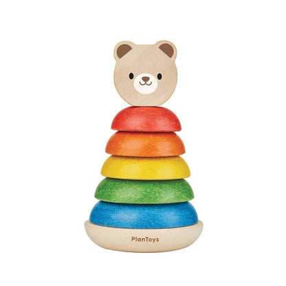 Isolated front view of the fully assembled PlanToys wooden bear stacker with its colorful rings.