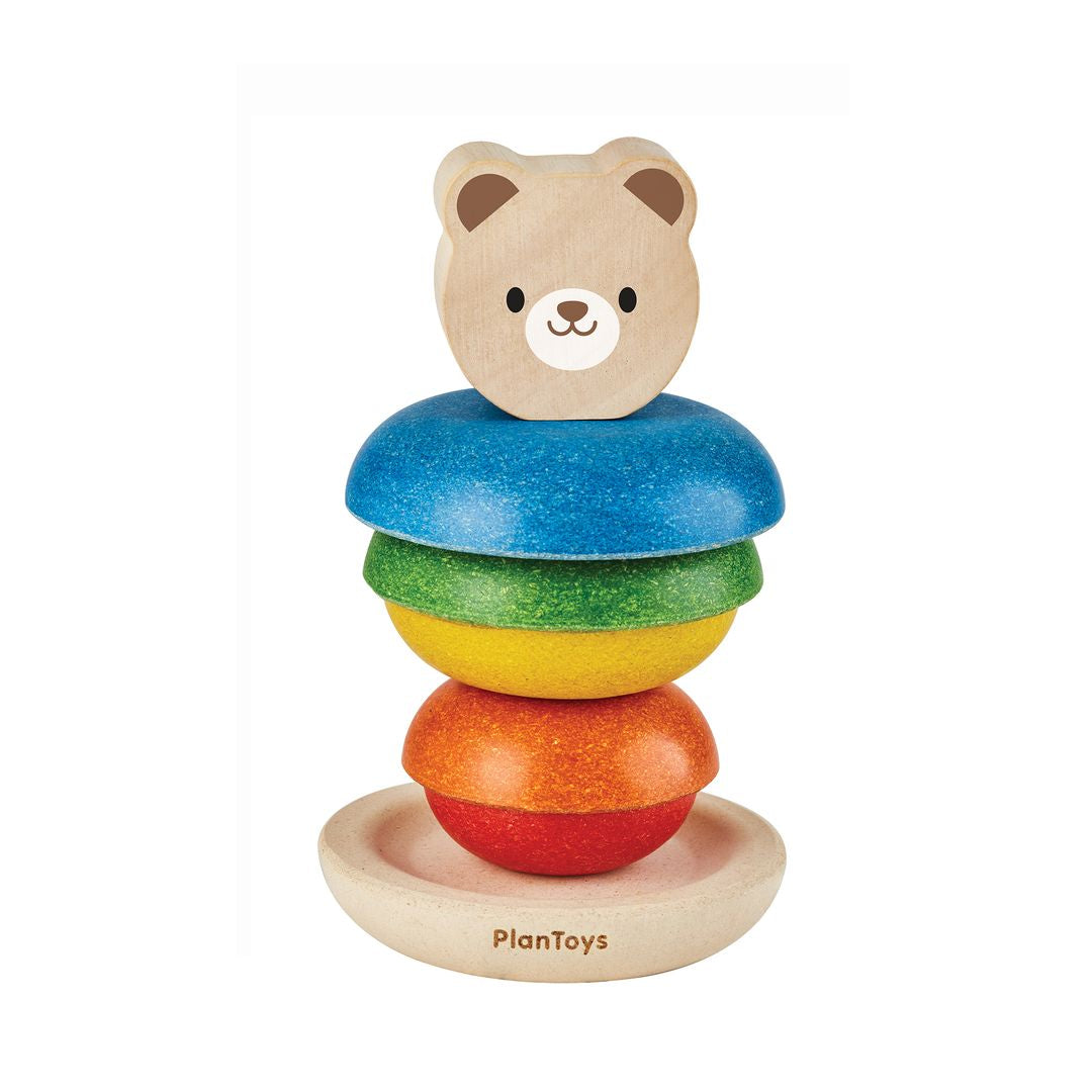 The chemical-free PlanToys wooden stacking ring bear isolated on a white background with the rings stacked in a different order.