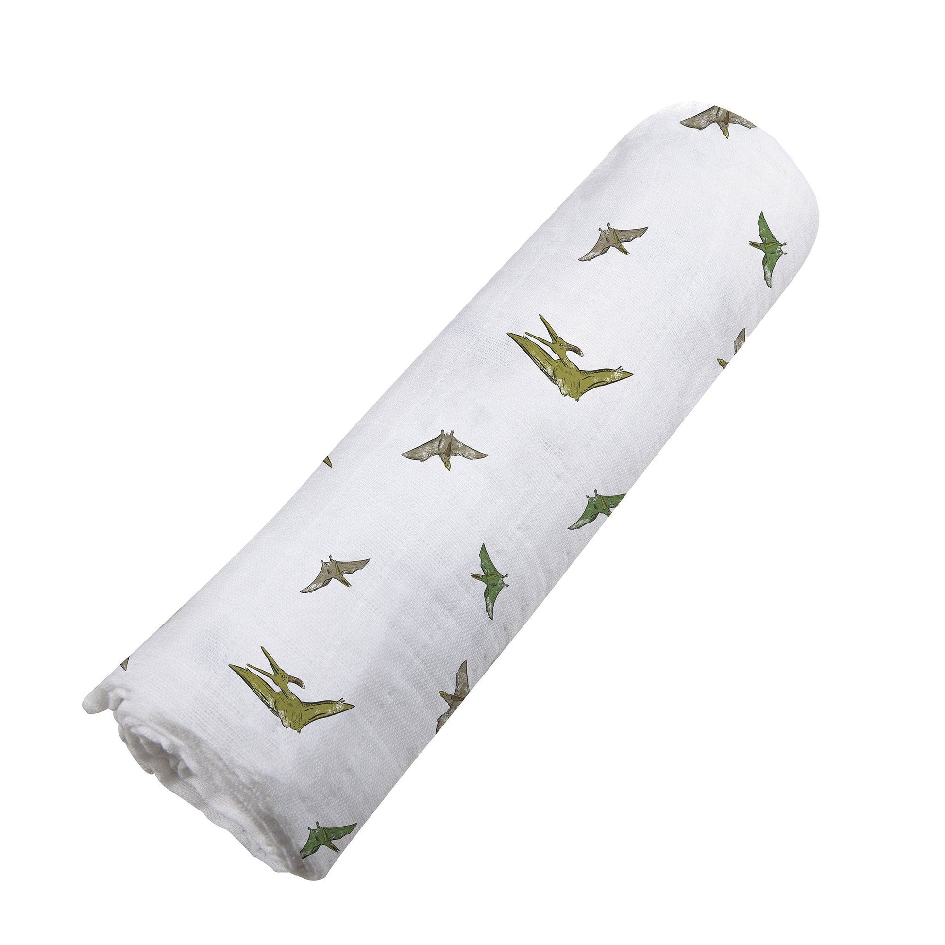 Angled view of the green Pteranodon dinosaur print cotton muslin swaddle blanket neatly rolled up.