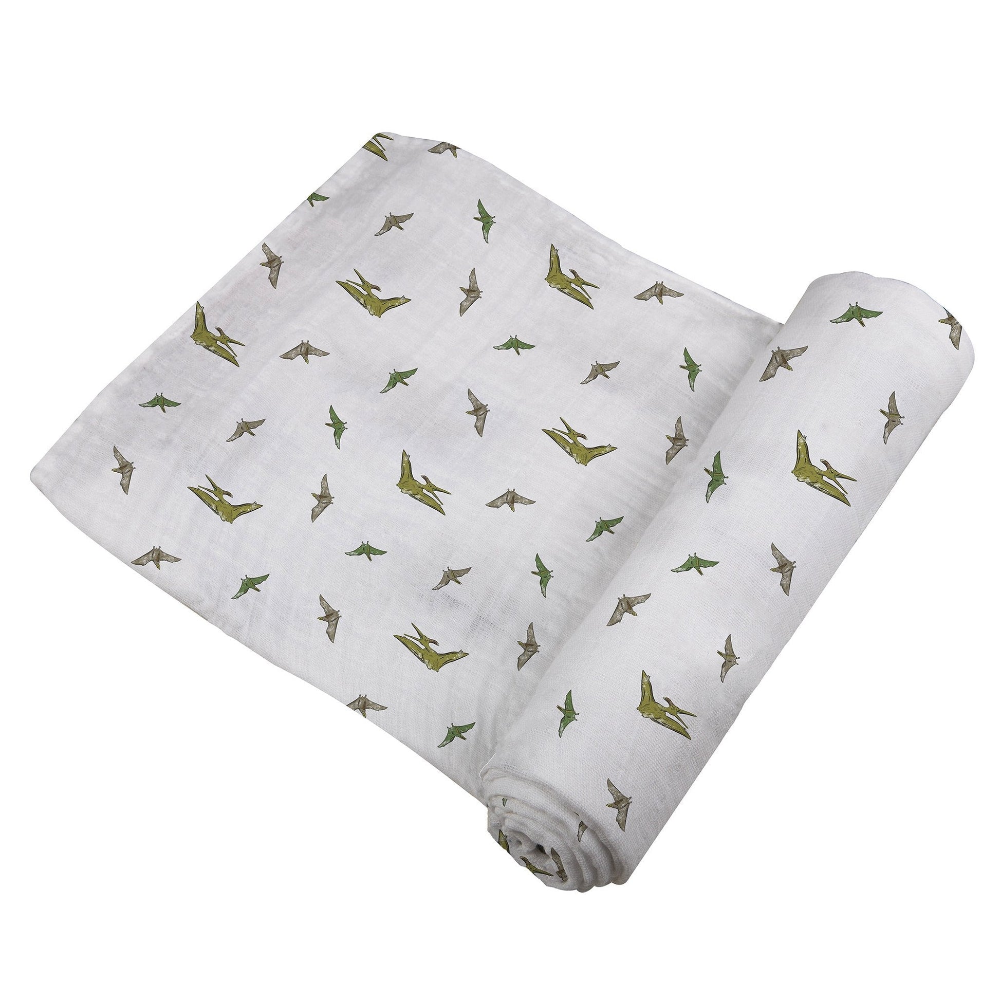 Angled view of the swaddle blanket partially unrolled to showcase the flying green dinosaur pattern.
