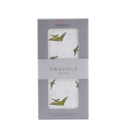 Straight front view of the packaged Pteranodon dinosaur baby swaddle blanket in a grey Newcastle Classics box.