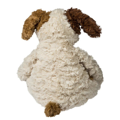 Side view of the slouchy Snuggables puppy plush showing its weighted bottom and soft spotted fabric.