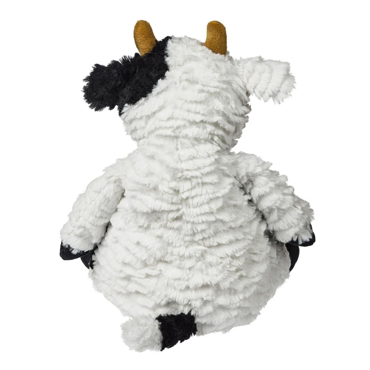 14-inch Mary Meyer cow sitting upright, highlighting its floppy understuffed body and plush feet.