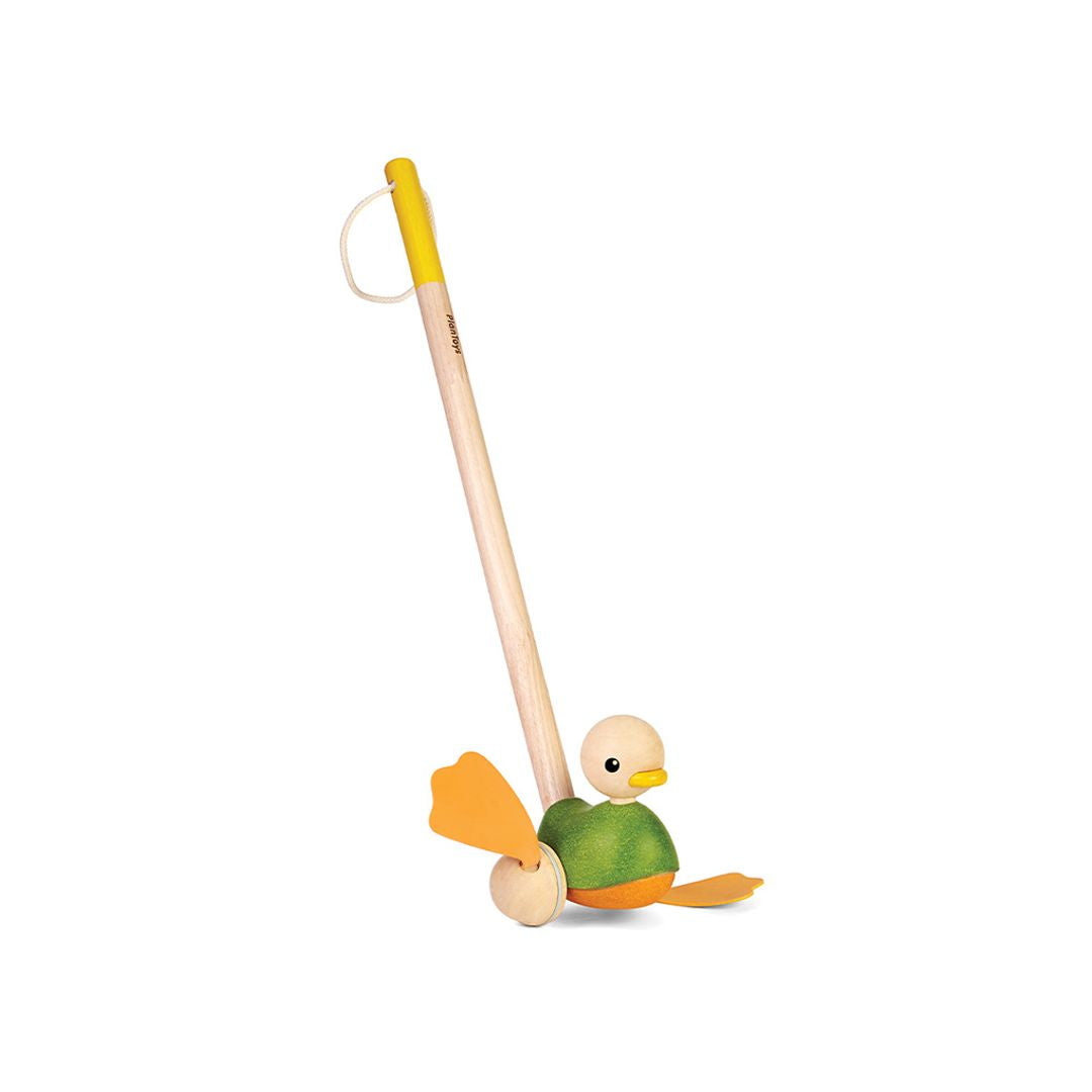 Side profile of the chemical-free rubberwood PlanToys push along bird showing its sturdy, toddler-safe design.