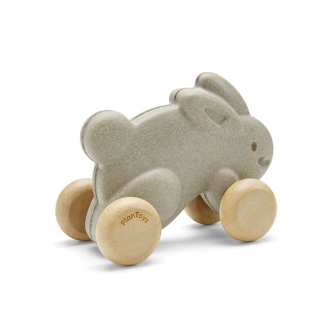 Rear view of the chemical-free rubberwood PlanToys push along rabbit showing its smooth, sturdy wheels.