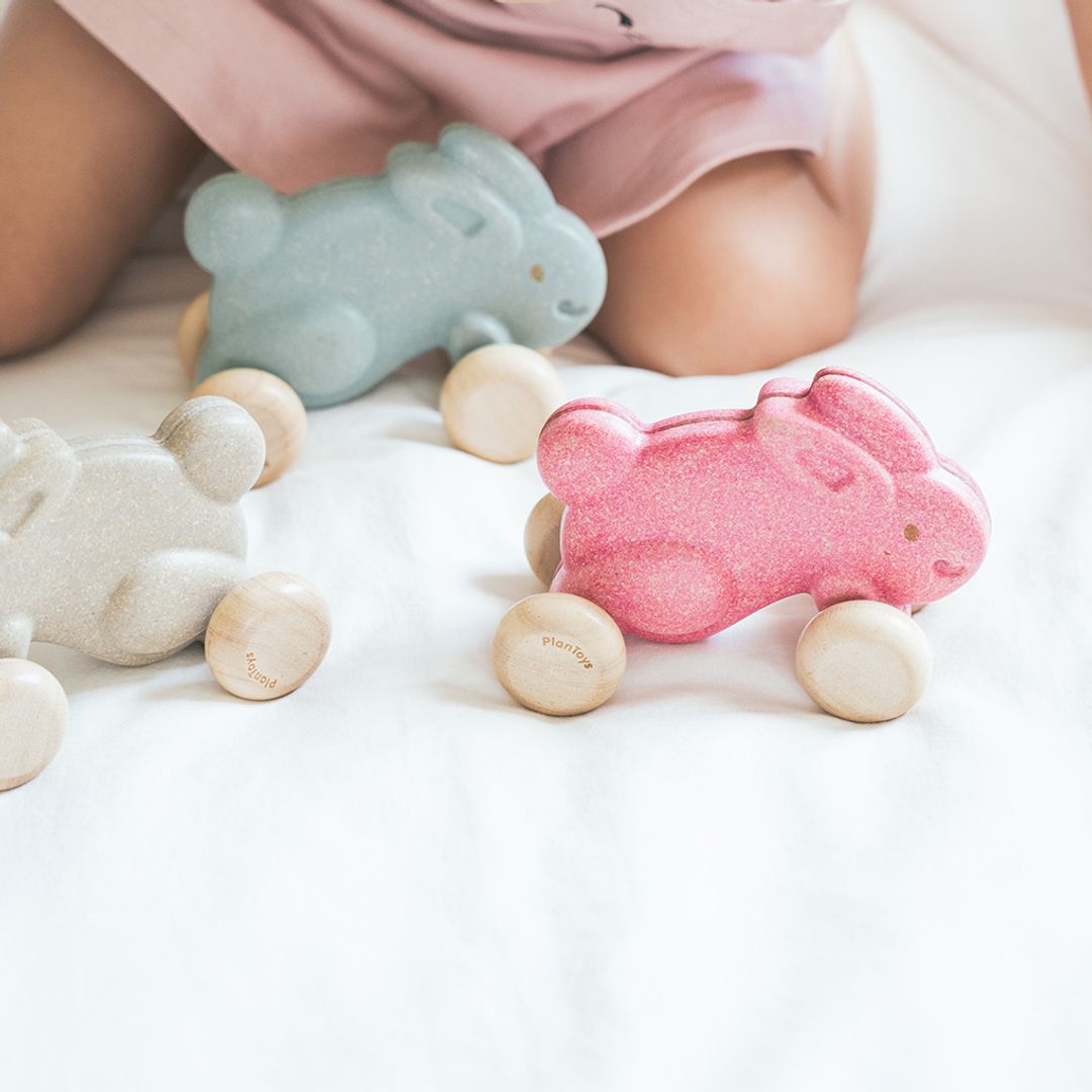 Close-up detail of the smooth, water-based painted finish on the eco-friendly grey PlanToys bunny toy.