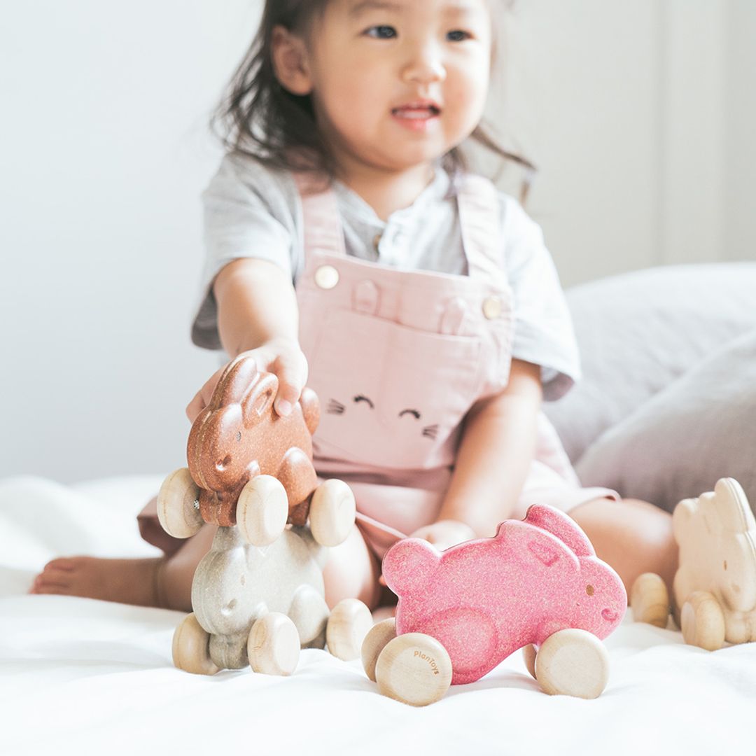 A young child developing fine motor skills 