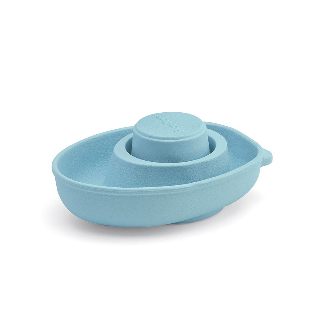 Angled view, sustainable PlanToys rubber convertible bath toy in pastel blue.