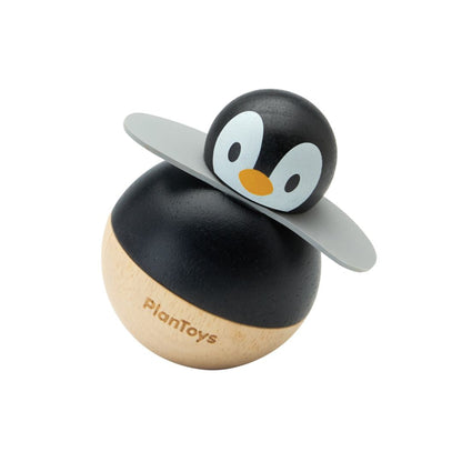 Angled right view of the chemical-free PlanToys penguin wobbler highlighting its natural wood base.