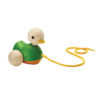 The heirloom-quality PlanToys wooden duck ready for playtime with its yellow pull string trailing behind.