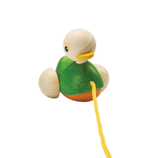 Front angle of the eco-friendly PlanToys wooden pull along duck featuring a bright green body and yellow string.