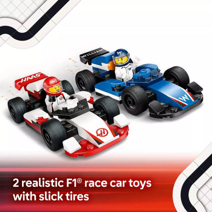 Two realistic F1 race car toys with slick tires on a white background
