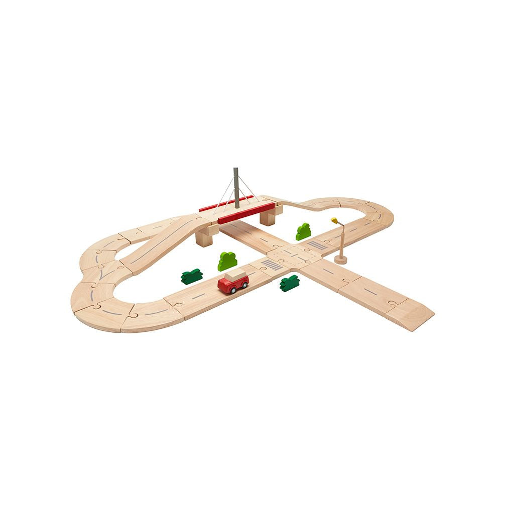 Detailed view of the smooth, chemical-free rubberwood finish on the PlanToys city-building road pieces.