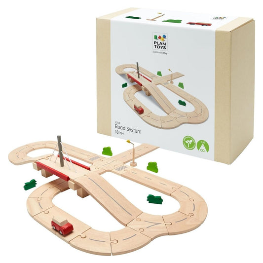 The PlanToys eco-friendly wooden road system displayed next to its sustainable, recyclable packaging.