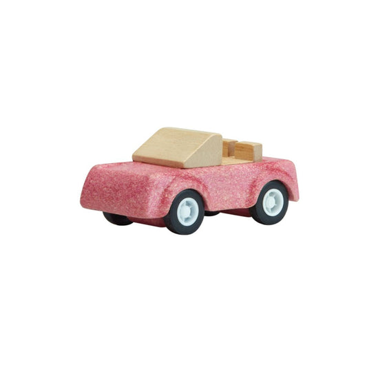 PlanToys wooden pink sports car toy.