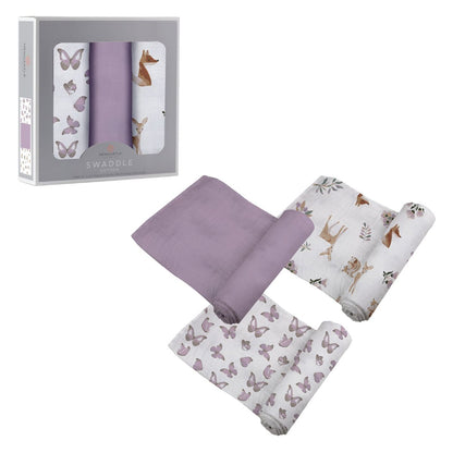 Three Newcastle Classics Mountain Meadow cotton muslin swaddle blankets partially unrolled next to their grey 3-pack window packaging box.