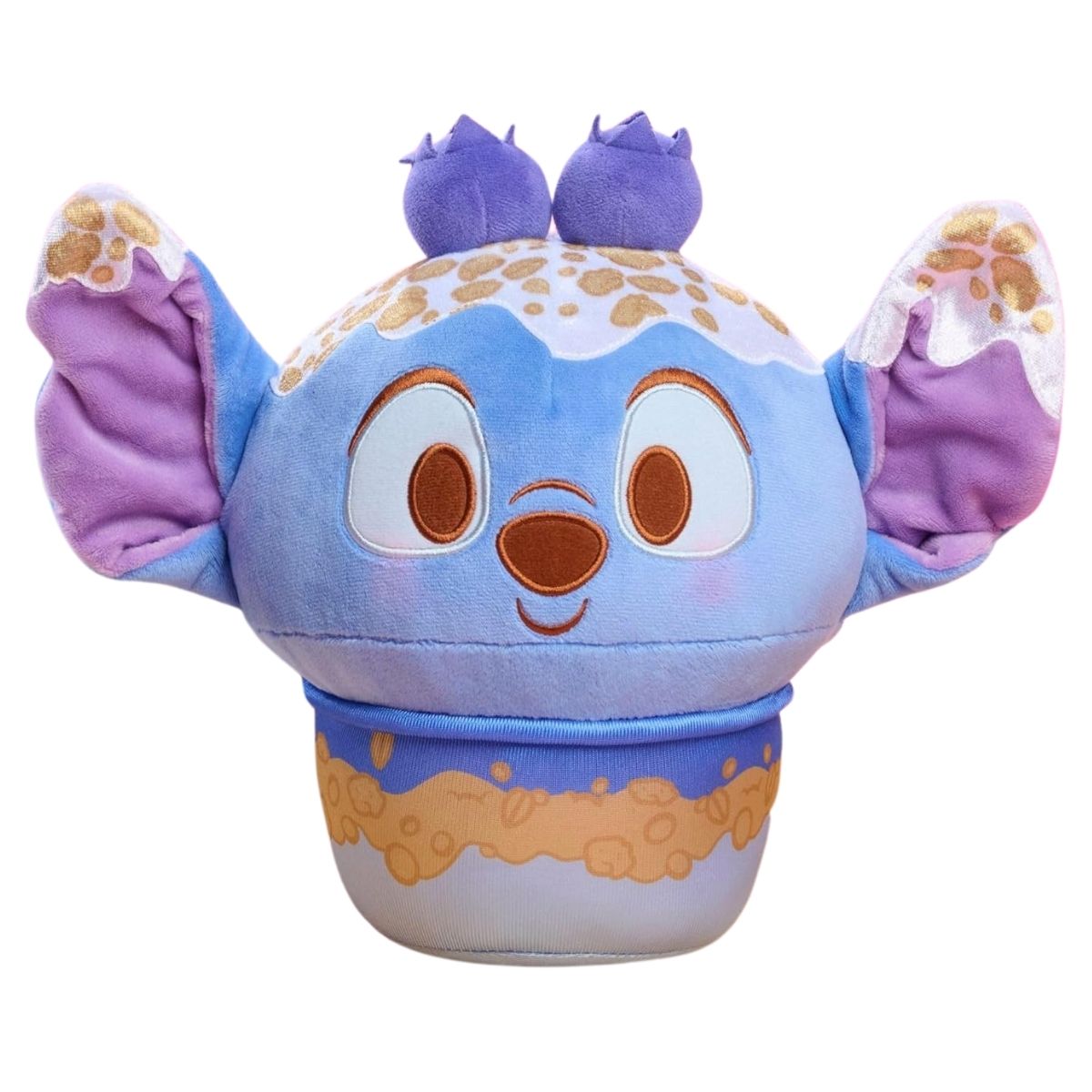 Front view of the 10-inch Disney Munchlings Stitch Blueberry Crumble Frozen Yogurt plush showing his large purple ears, sweet face, and blueberry details.
