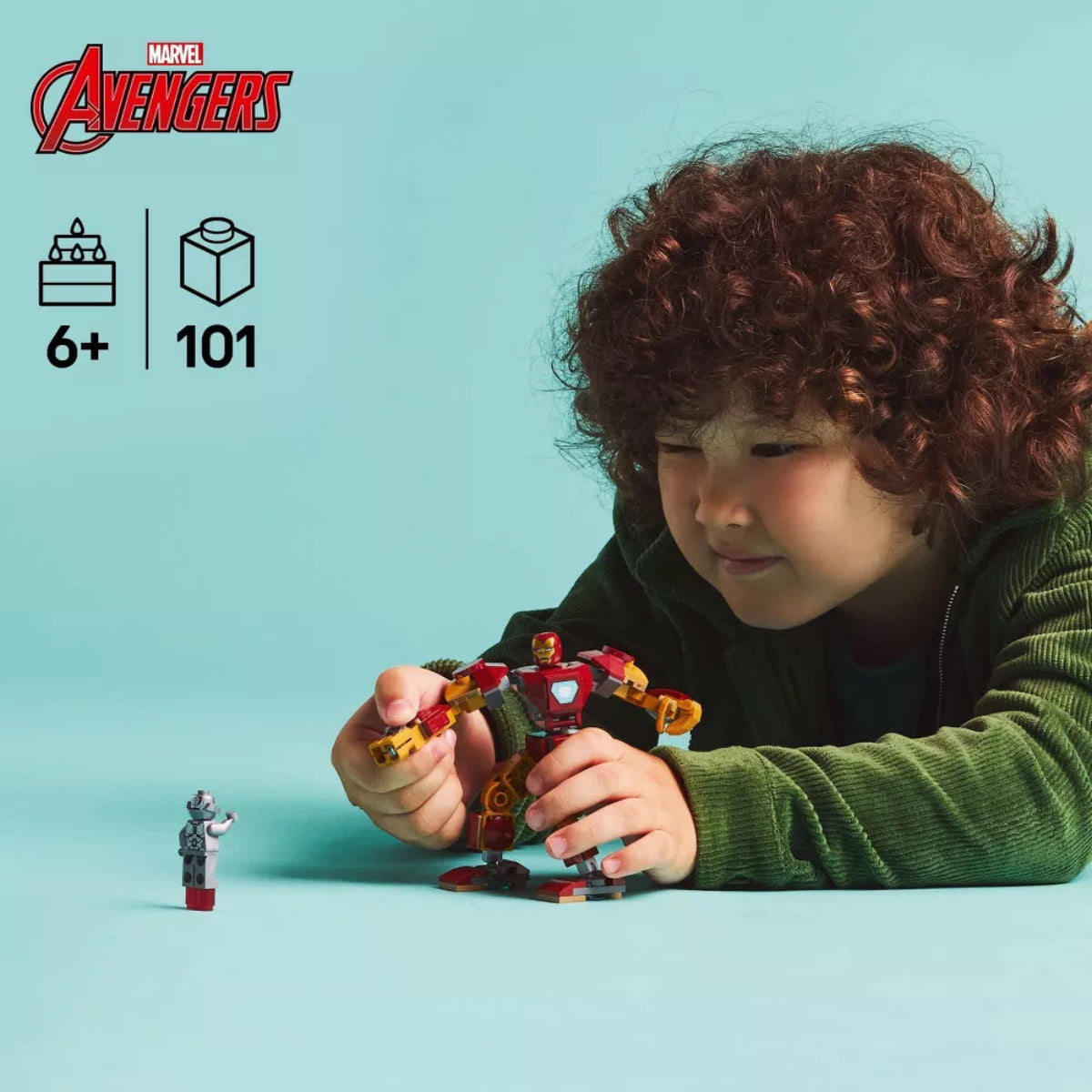 Child playing with Marvel Avengers toy set on a light blue background