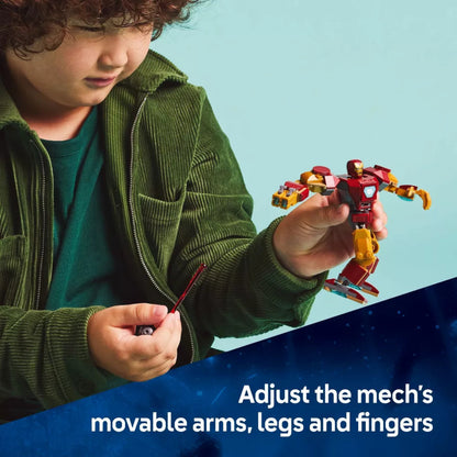 Child playing with a toy robot against a blue background