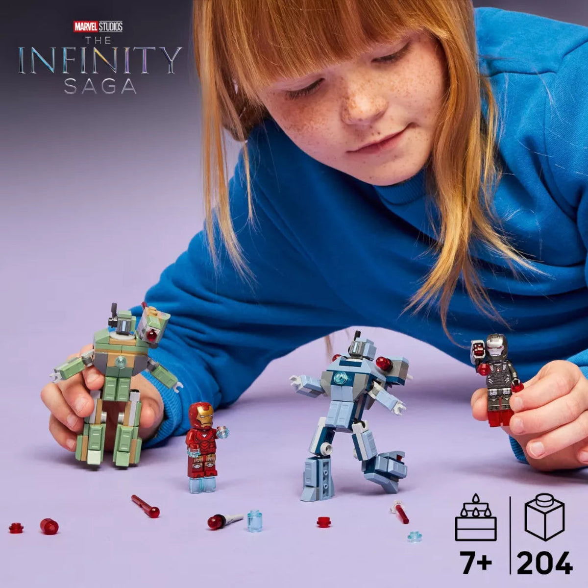 Child playing with Marvel Infinity Saga toy figures on a purple background