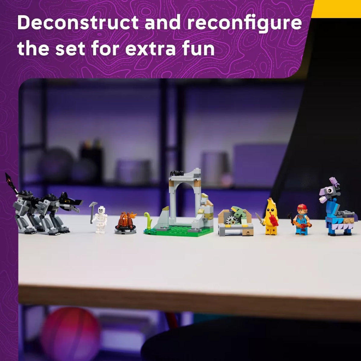 Toy set with figures and structures on a table, promotional text about deconstructing and reconfiguring the set.