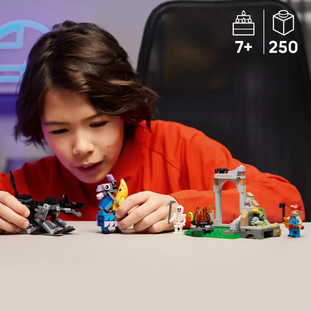 Child playing with LEGO sets on a table, with age and piece count indicators.