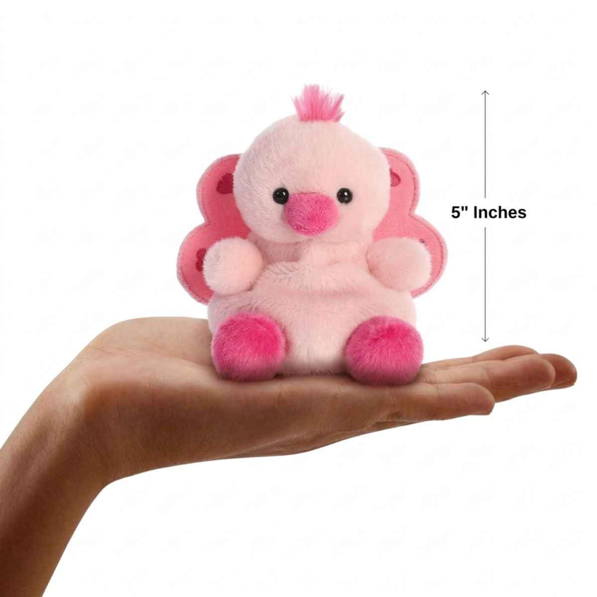 The miniature Freya Peacock plush sitting balanced in an open human hand under a 5-inch height graphic indicator.