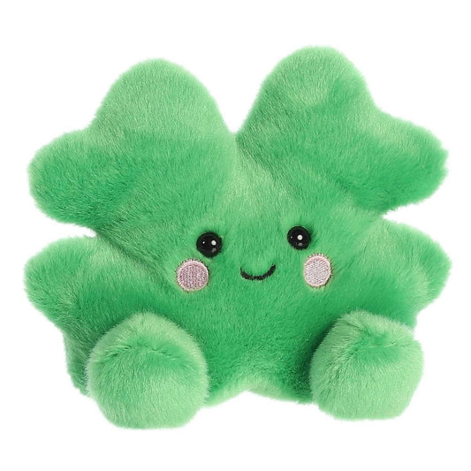 Angled front view of the 5-inch Aurora Palm Pals Chance Clover plush sitting, showing its bright green four-leaf clover shape and sweet face.