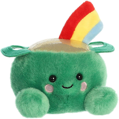 Angled front view of the 5-inch Aurora Palm Pals Ciara Pot of Gold plush sitting, showing its green body, shiny top, and rainbow.