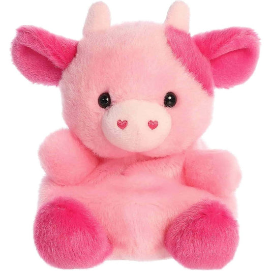 Straight front view of the sitting pink cow plush showing its sweet black eyes, pale pink horns, and hot pink hooves.