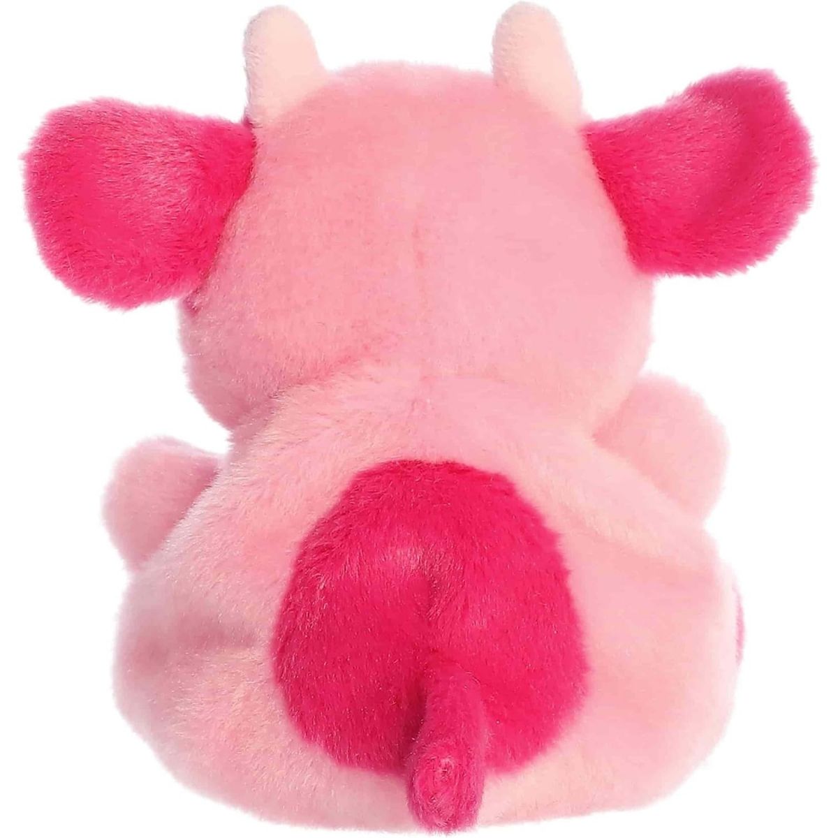 Back view of the Aurora pink cow plush showcasing its soft pastel pink plush texture and hot pink spots on its back.