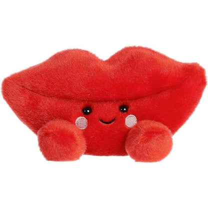 Straight front view of the sitting red lip plush showing its plump shape, black dot eyes, and little plush feet.