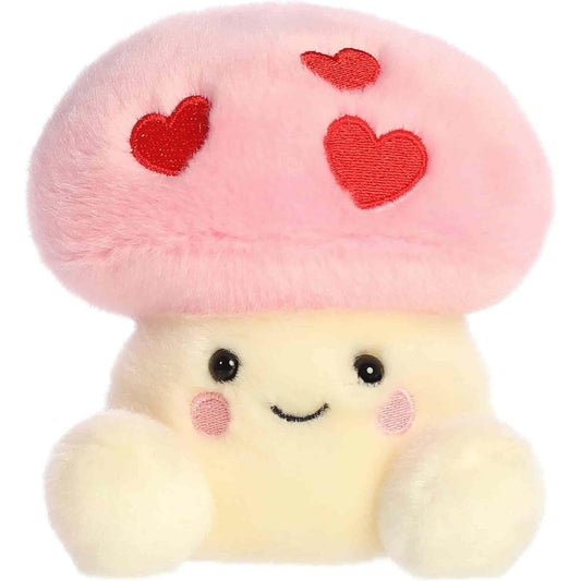 Side profile view of the Palm Pals Brooklyn Mushroom highlighting the fluffy texture of the pink heart-spotted cap and its rounded shape.