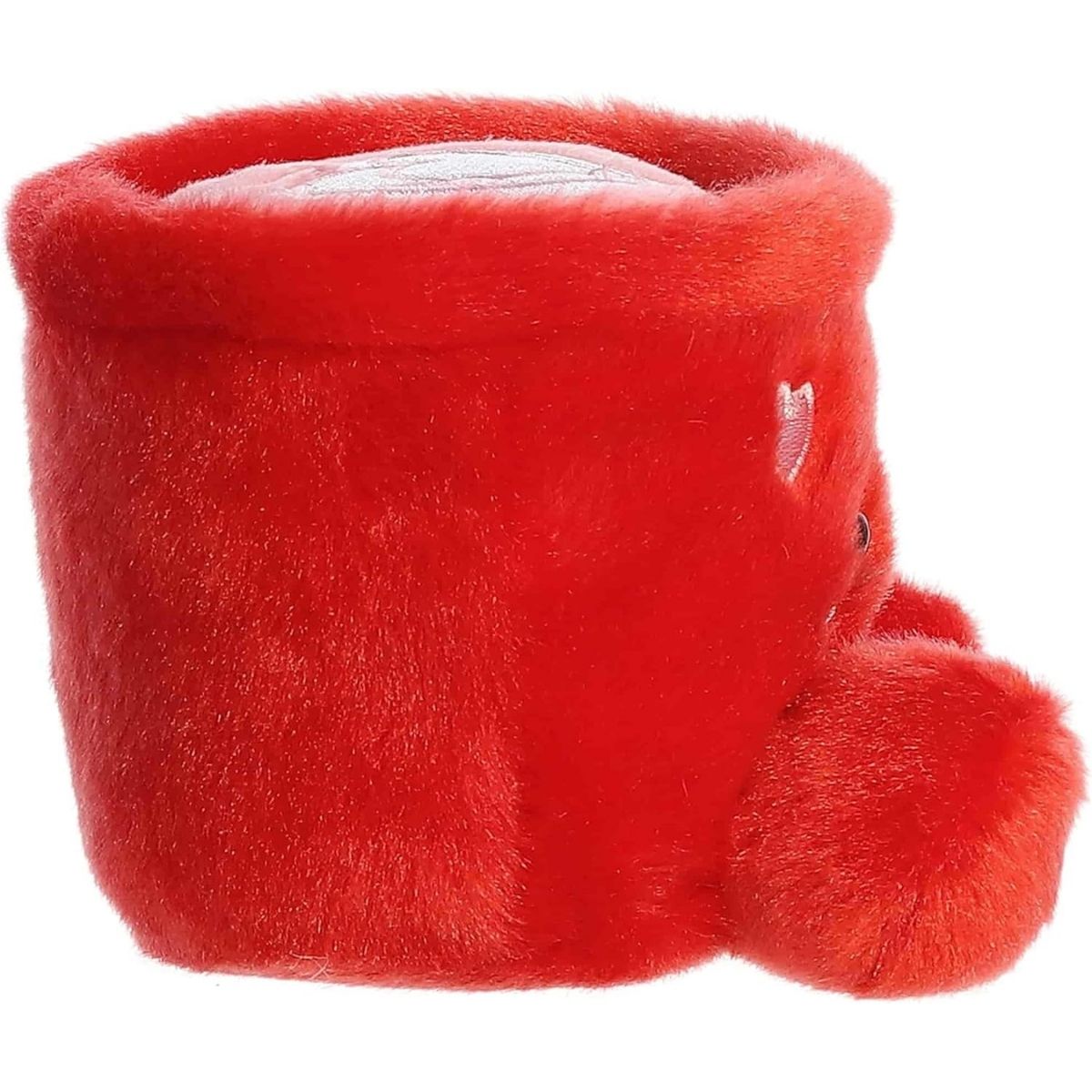 Side profile view of the Aurora latte mug plush highlighting its plump, rounded shape and the attached handle.