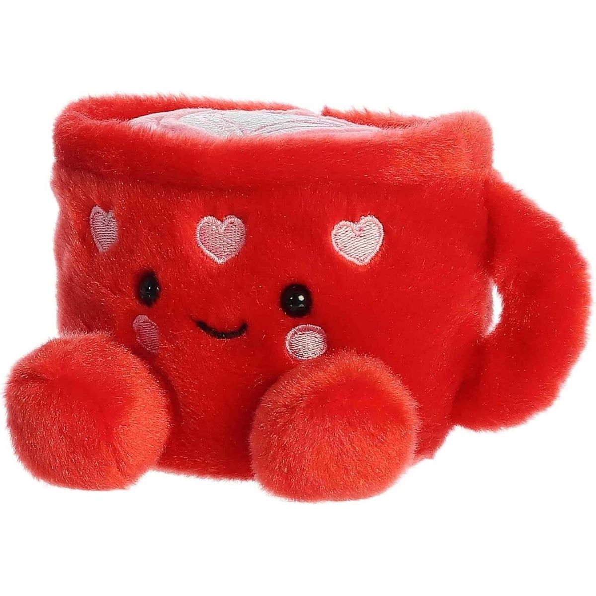 Angled front view of the smiling Lotti Love Latte plush sitting happily on its little plush feet.