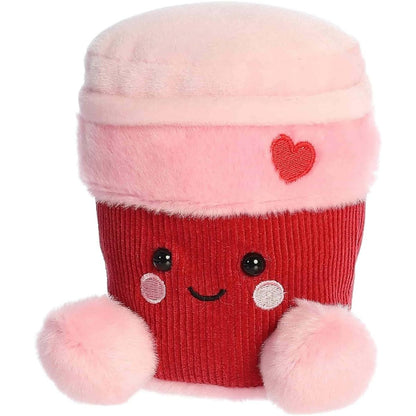 Angled front view of the smiling Parker Heart Coffee plush sitting happily on its little plush bottom.